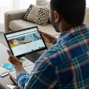 Sales professional using a CRM system to manage the B2B sales funnel, with visual representation of lead stages