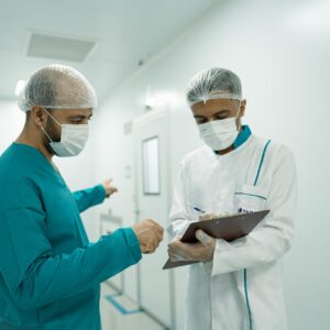 Instructor teaching Healthcare Operations Management to hospital staff